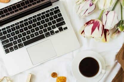 office laptop flatlay illustrating how I make extra money online