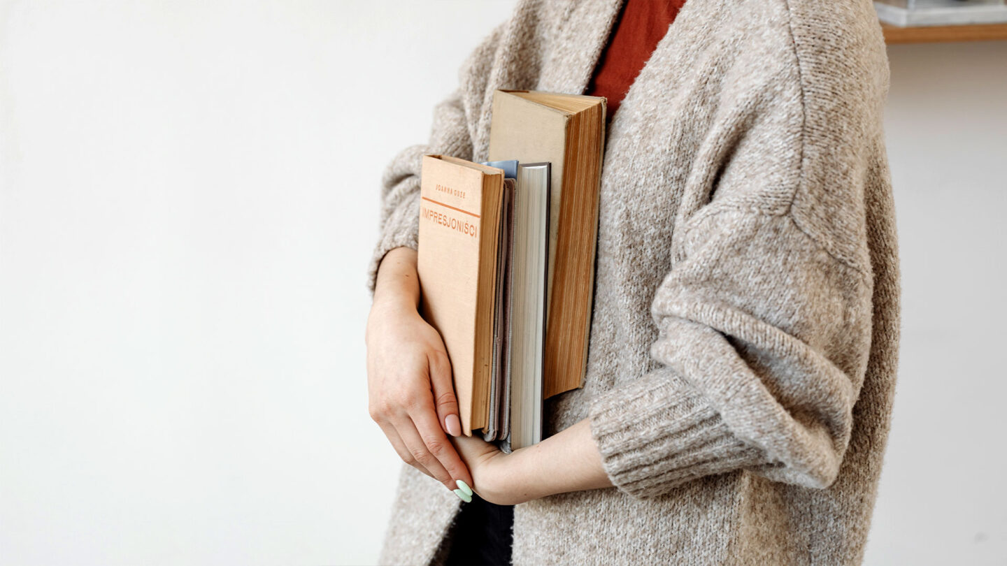 woman holding books