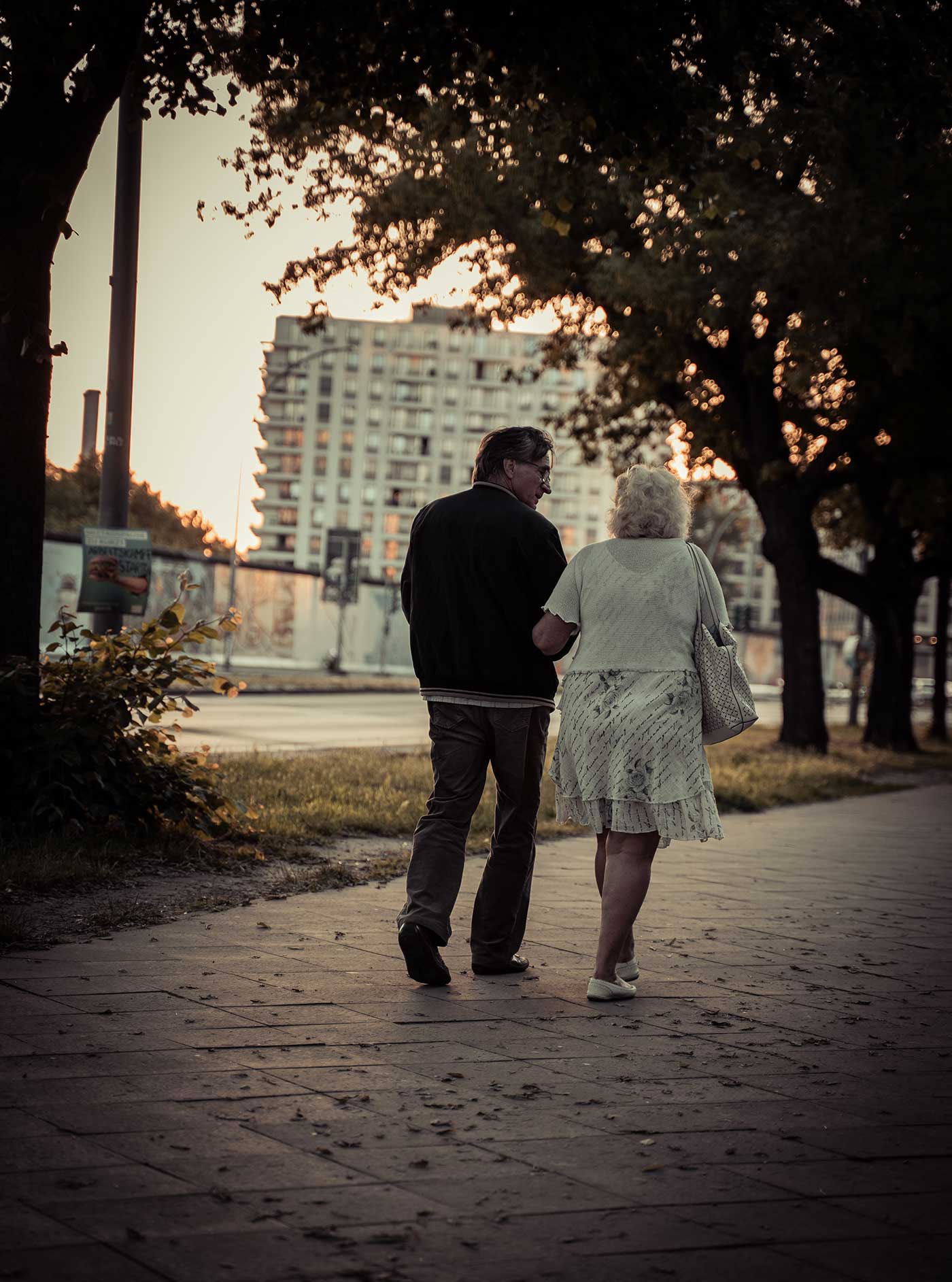 Older couple dating, walking along a river. Online dating at any age!