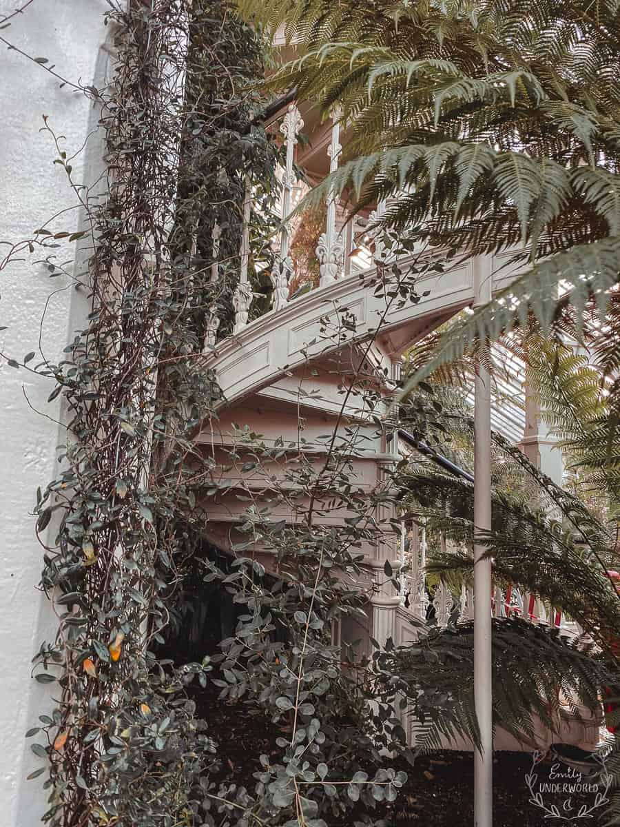 Kew Gardens vintage spiral staircase with plants.