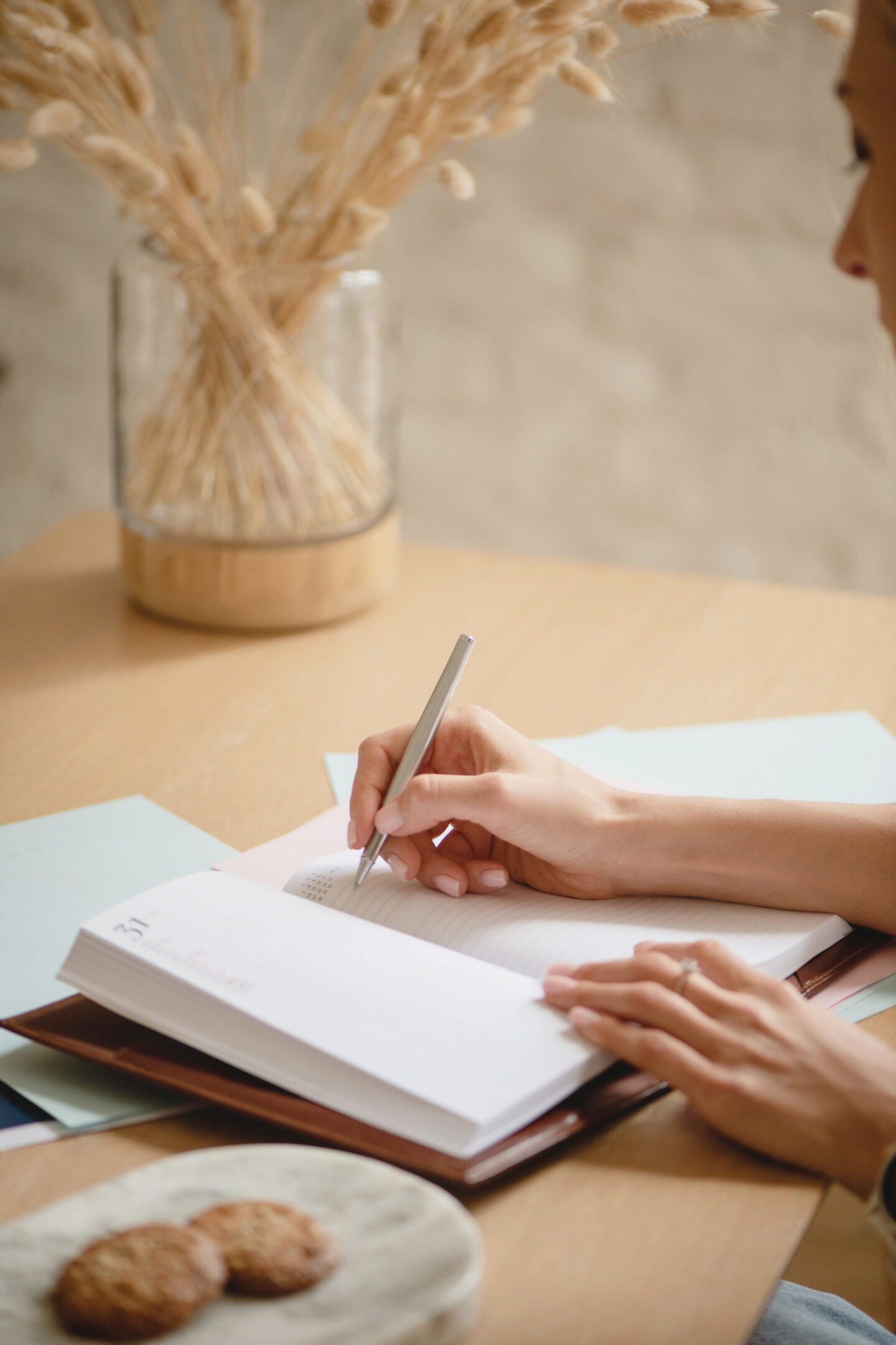 Woman writing in a diary or planner