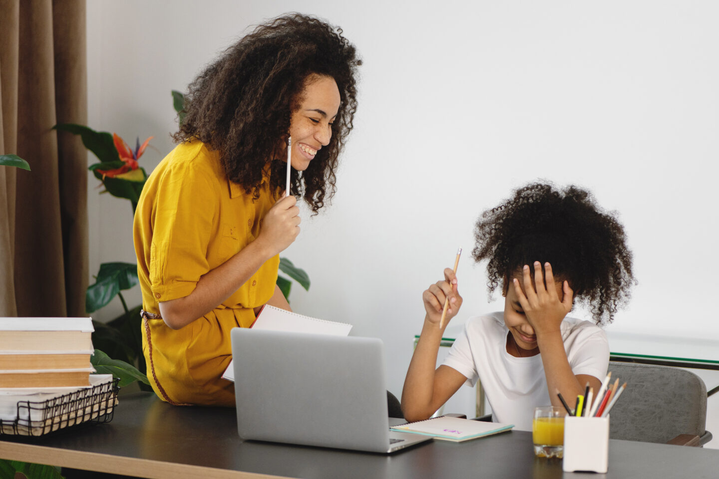 Woman and daughter learning at home