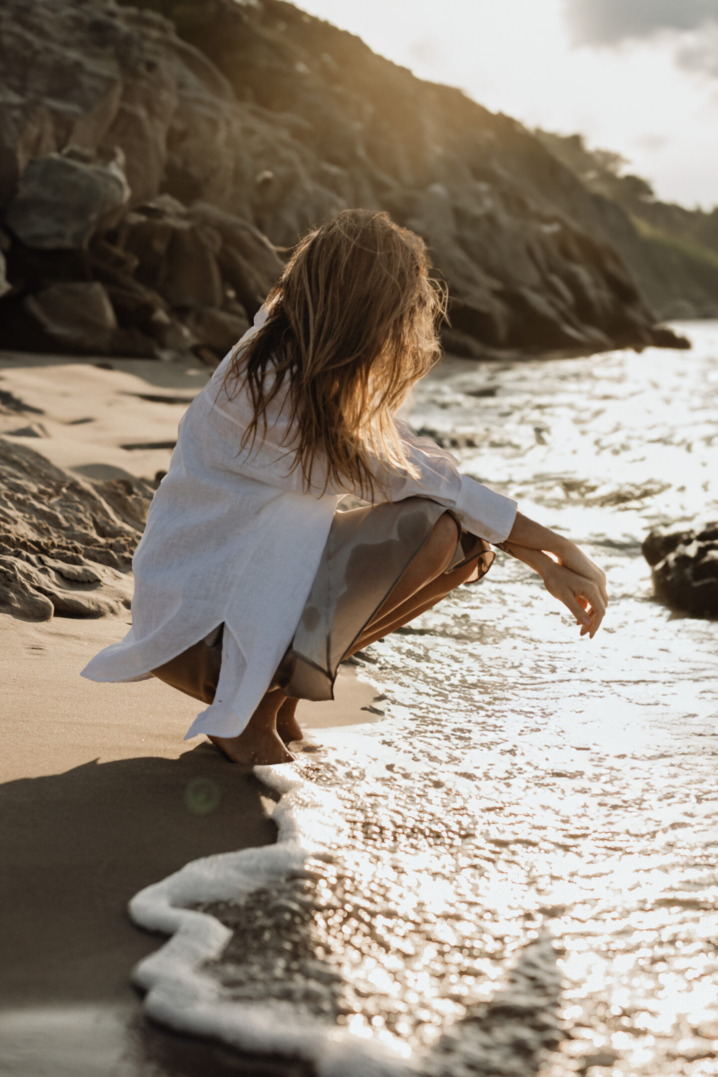 woman on the beach in algarve portugal