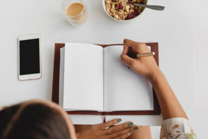 morning routine picture, woman writing in a journal