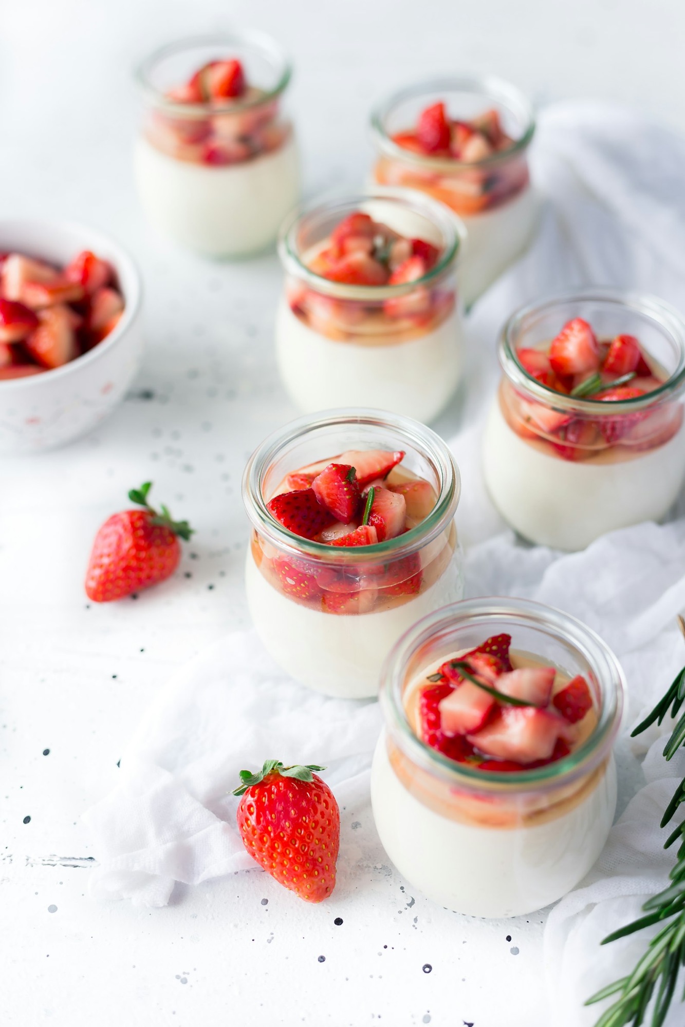 cute pots of strawberries and yoghurt.