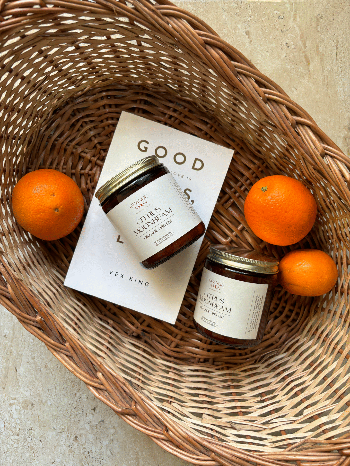 self-care basket with book, oranges and skincare products