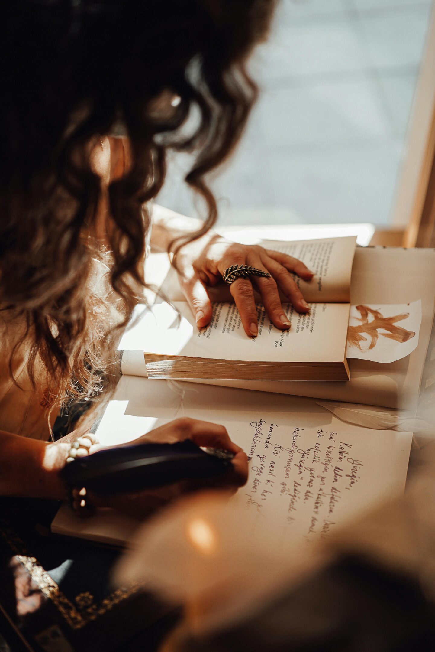 woman writing in journal