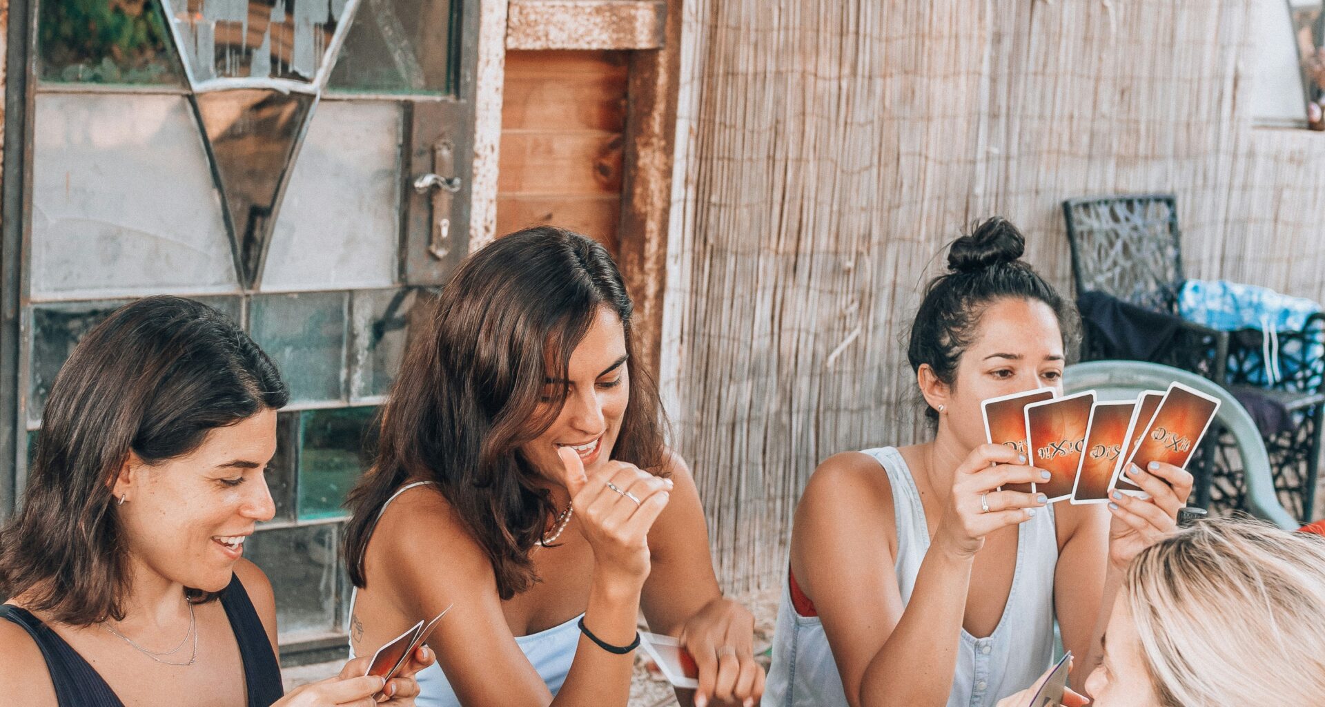 girls having a games night outside in summer
