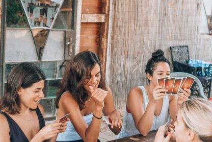 girls having a games night outside in summer