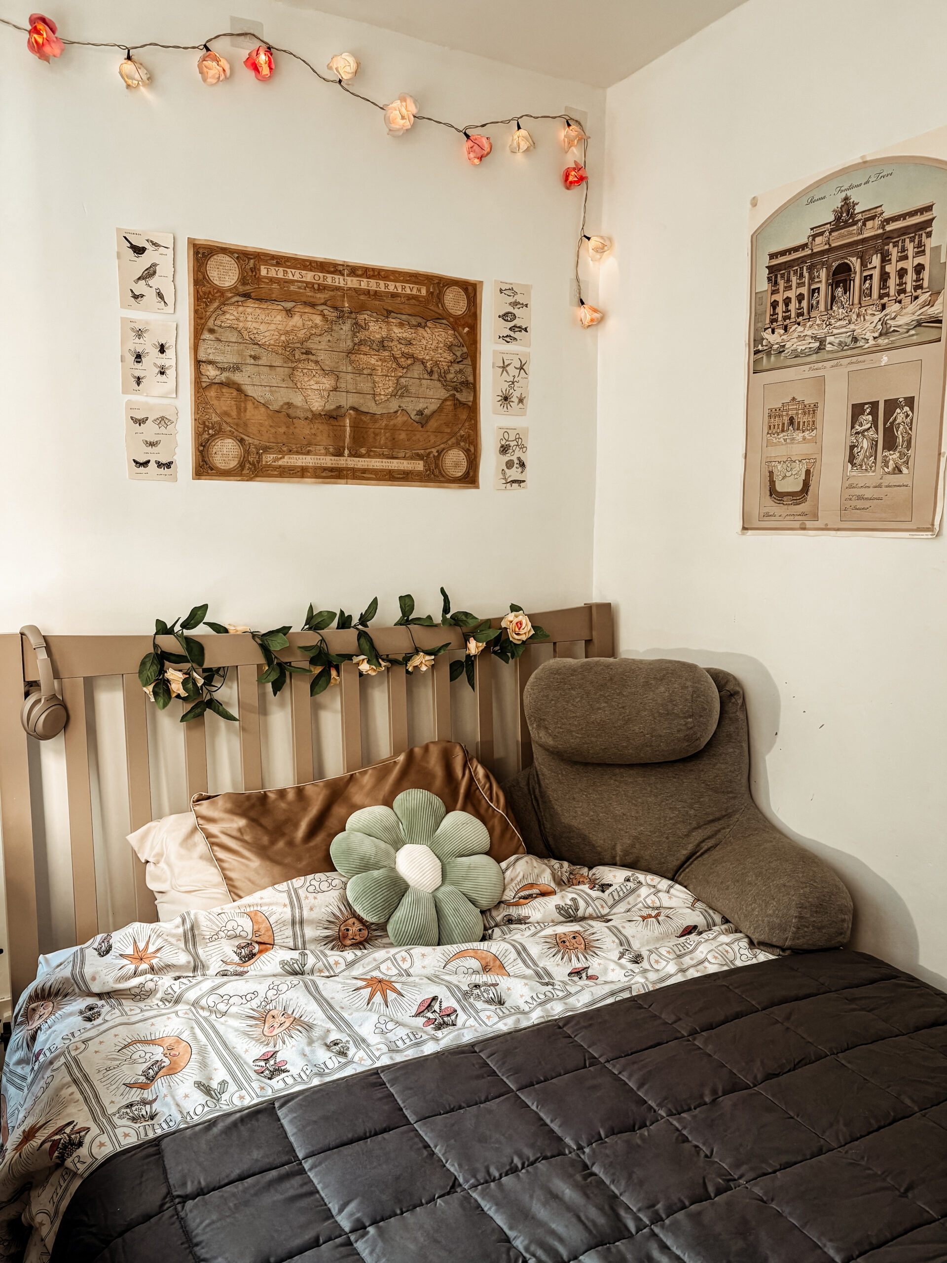 Cozy light academia style autumnal bedroom with weighted blanket and bed pillow seat.