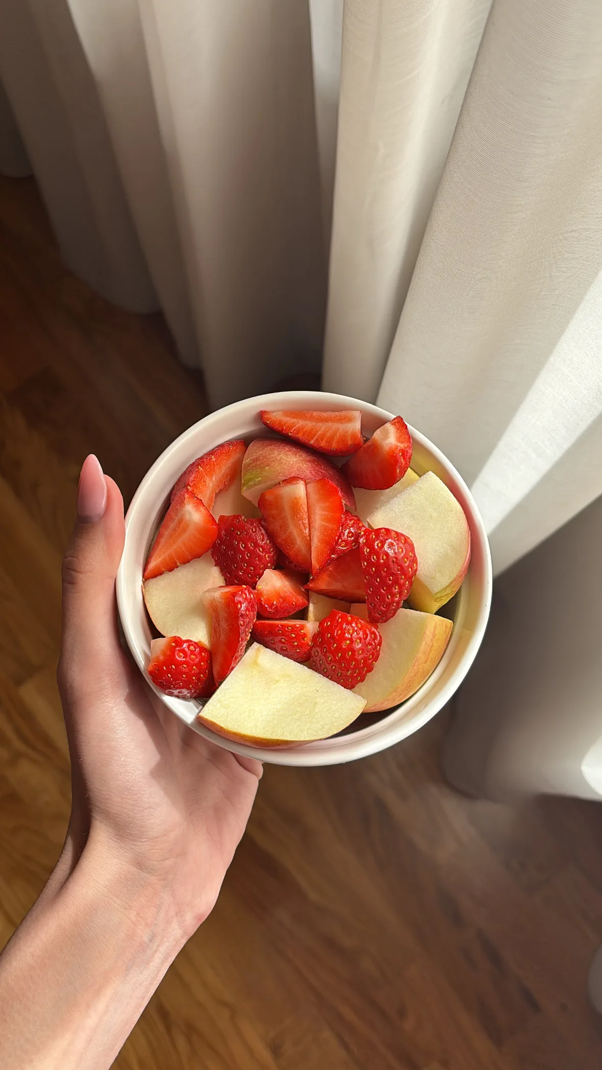 holding bowl of fruit