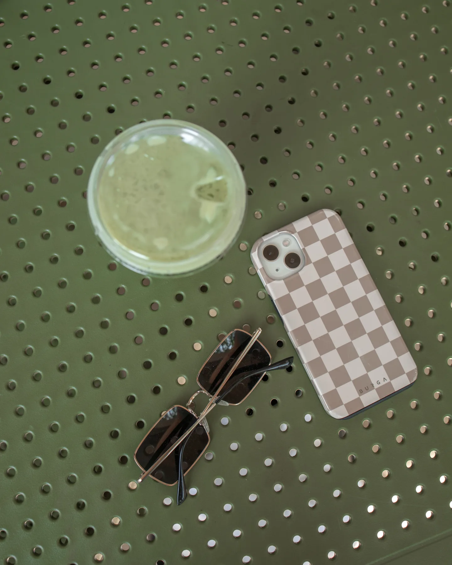 flatlay matcha sunglasses phone case