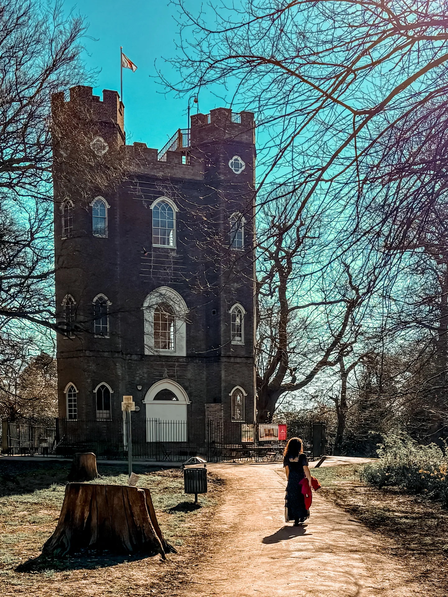 Girl wearing spring dress walking towards Severndroog castle