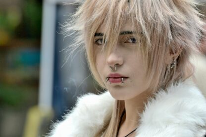 person with facial piercings