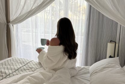 woman sitting in bed