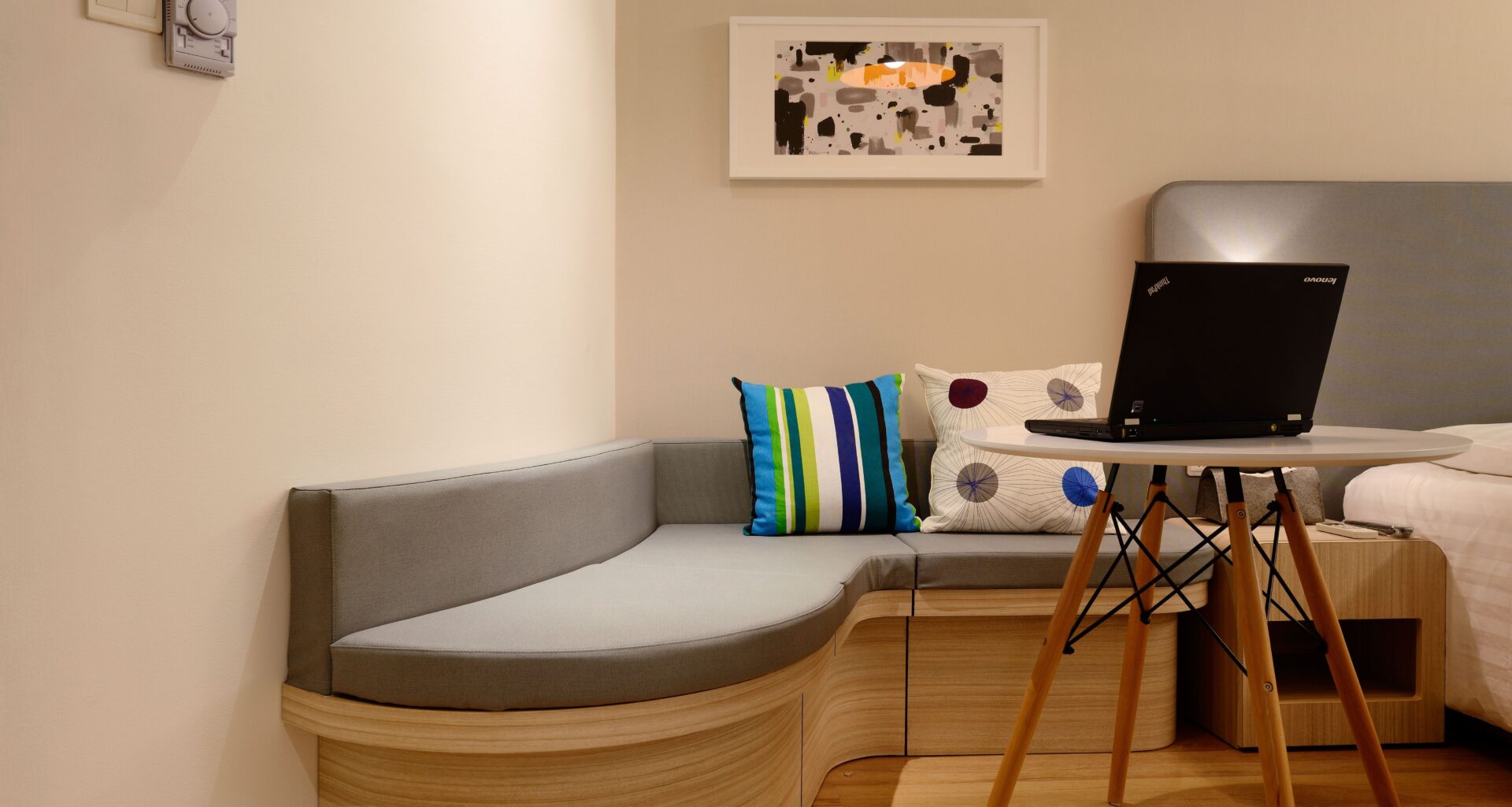 laptop on table next to seating