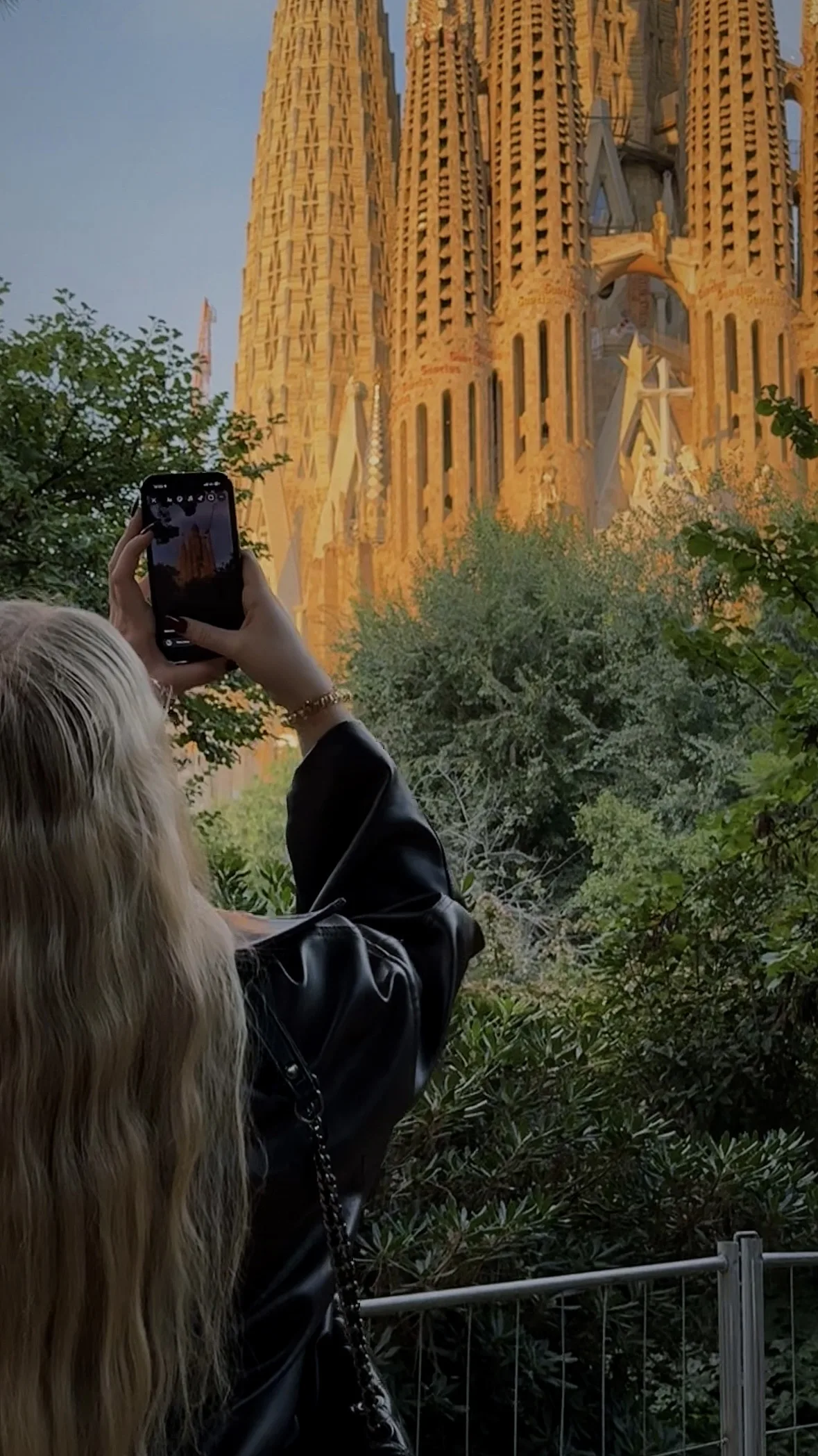 taking a photo of the sagrada familia in barcelona spain